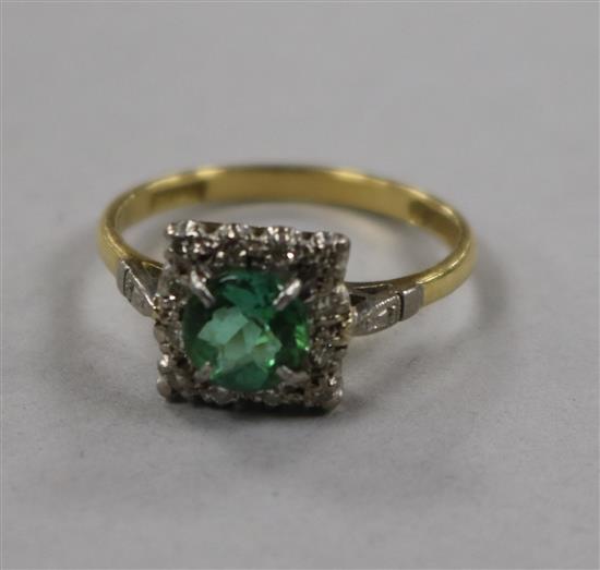 An early 20th century 18ct gold, green tourmaline and diamond square cluster ring, size M.